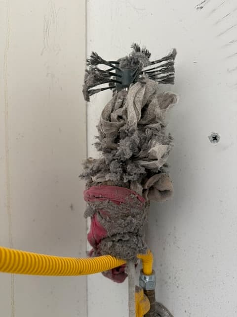 underwear and socks struck in a dryer vent